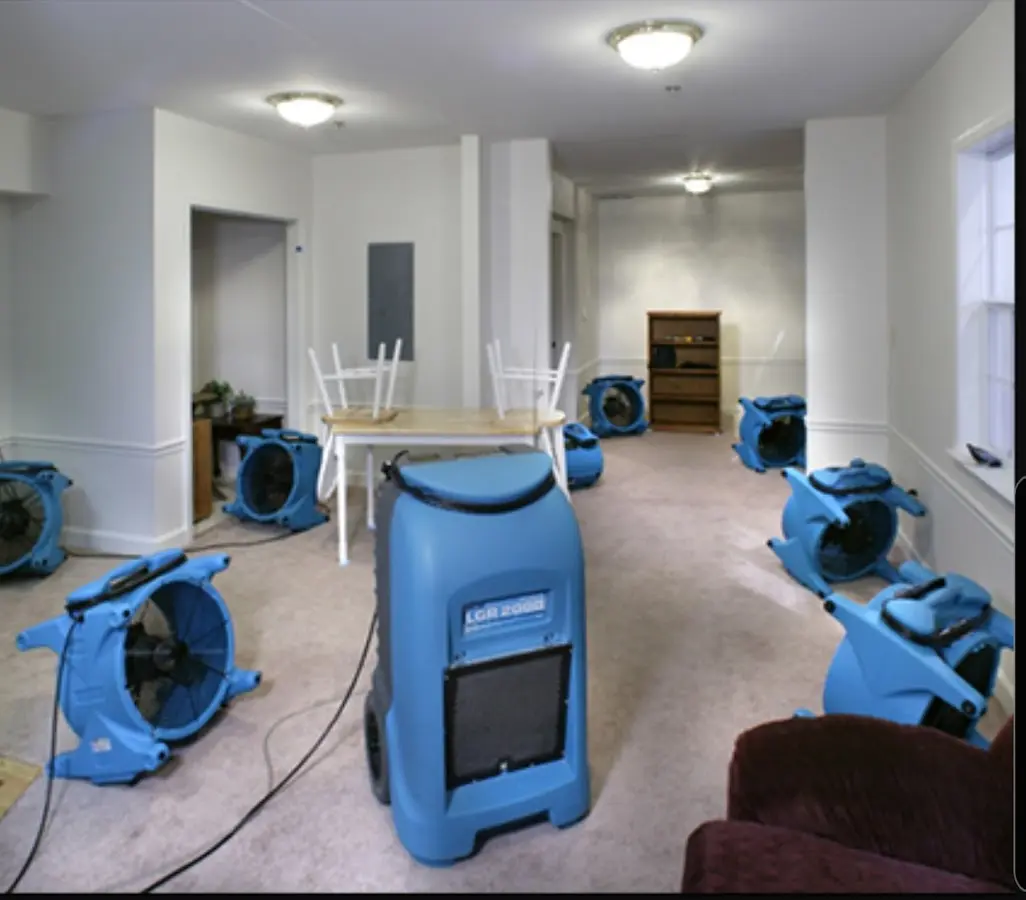 Air movers and dehumidifier setup for Water Damage Restoration in Collier